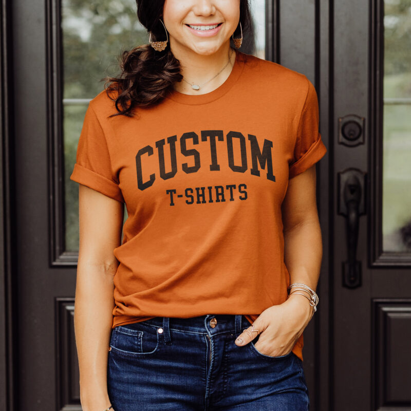 A woman wearing a custom print t-shirt in Autumn