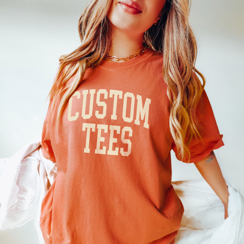 a woman wearing a Custom Comfort Colors Tee - Fall Colors in Yam
