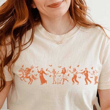 a woman wearing a Halloween Monster Parade T-Shirt in ivory
