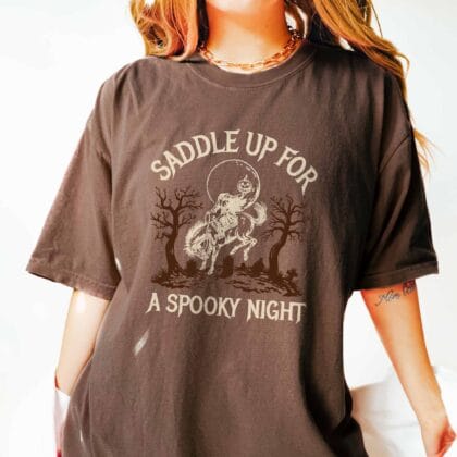 a woman wearing a headless horseman tee in espresso