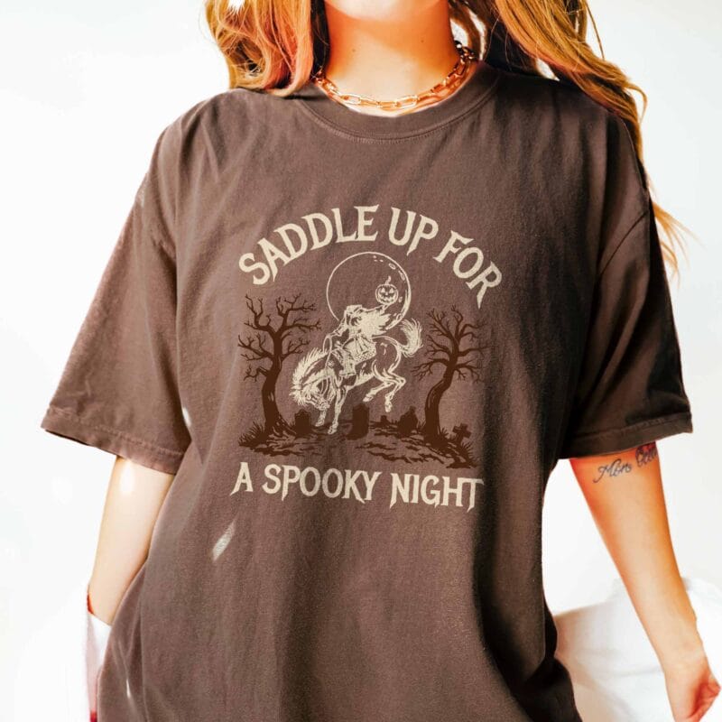 a woman wearing a headless horseman tee in espresso