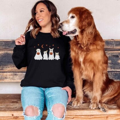a woman wearing a ghost dogs sweatshirt in black