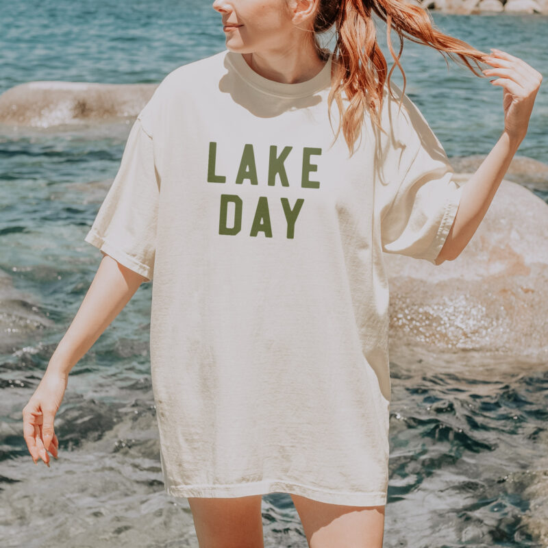 a woman wearing a lake day tee in ivory