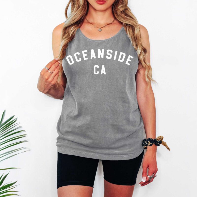 a woman wearing an Oceanside Ca varsity tank top in grey