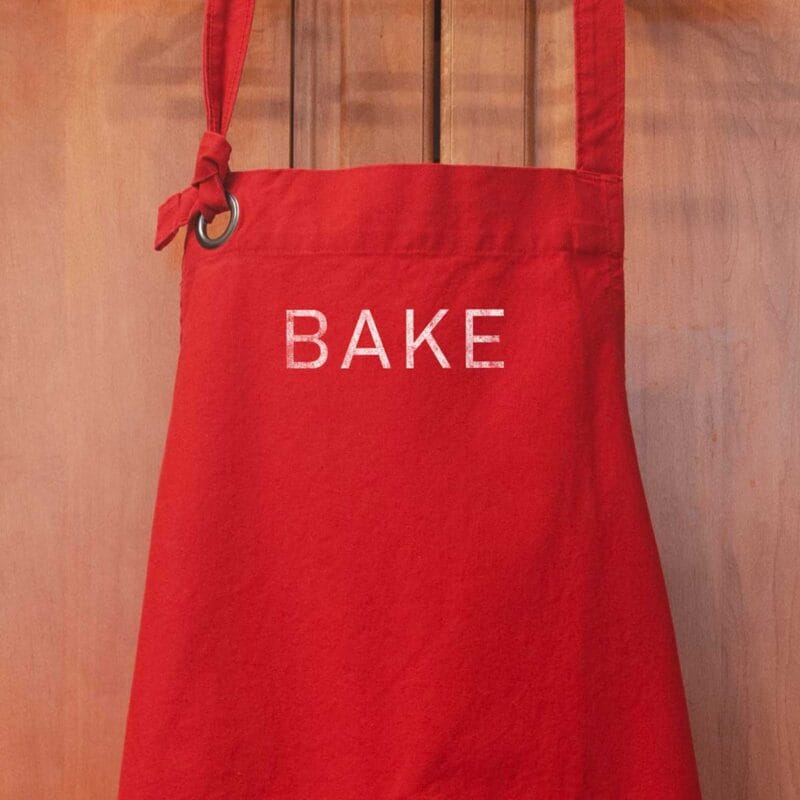 a Heavy Cotton Canvas BAKE Apron in red