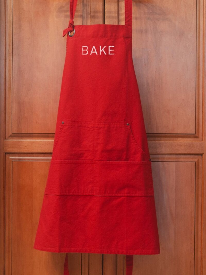 a Heavy Cotton Canvas BAKE Apron in red