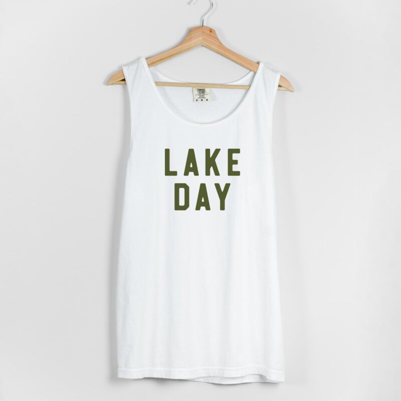 a woman wearing a lake day tank top in white