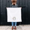 a woman holding a a Sourdough Therapy Tea Towel in dark chocolate