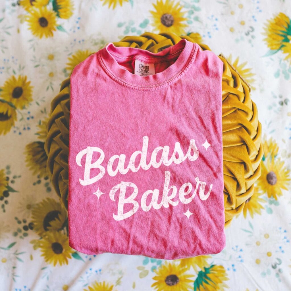 a Retro Badass Baker Garment Dyed Tee in crunchberry