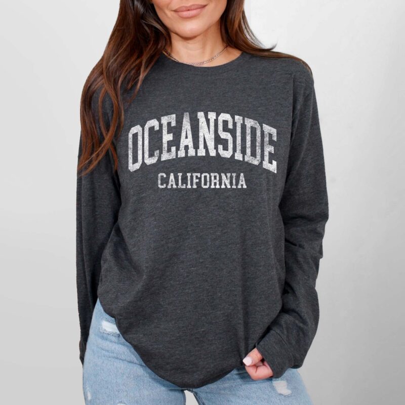 a woman wearing a Custom Long Sleeve Heather Tee