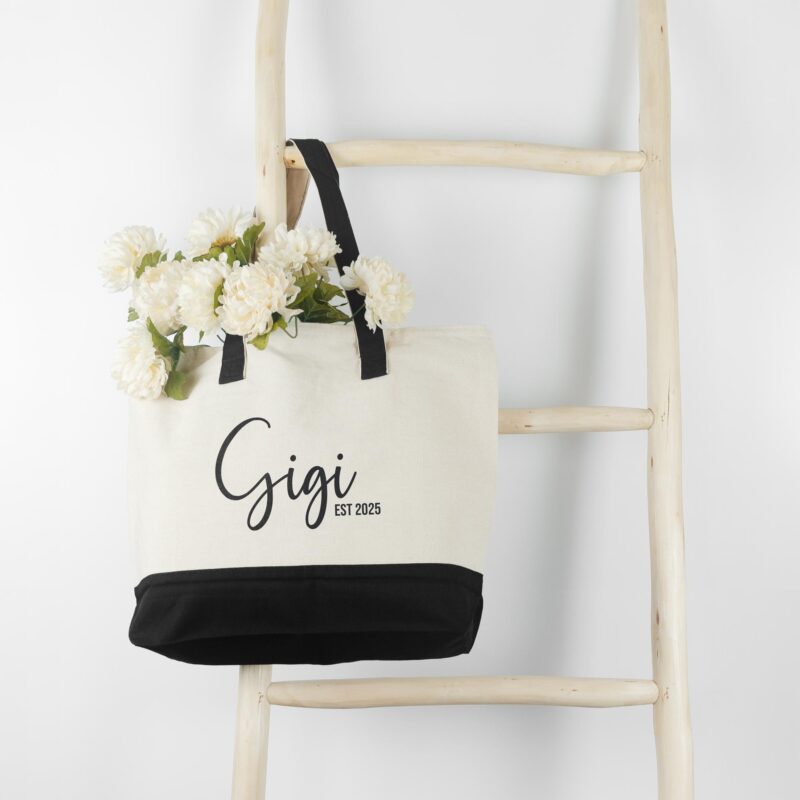 a first time new grandma personalized tote bag in black