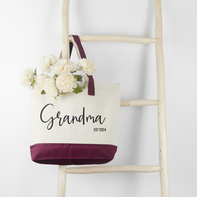 a first time new grandma personalized tote bag in burgundy