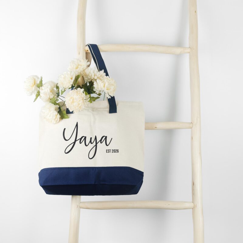 a first time new grandma personalized tote bag in navy