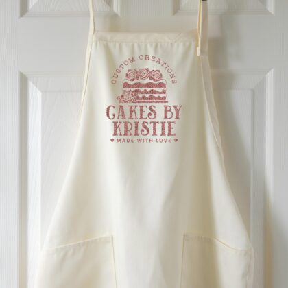 a Create the perfect gift for your favorite baker or cake decorator with the Personalized Cake Baker Basic Apron by Peculiar People Designs. Fully customize this pretty baking apron with your words and choice of apron style, color and print color. All text is editable! The cake graphic is automatically included. Available in an array of colors in both Short or Regular length.Create the perfect gift for your favorite baker or cake decorator with the Personalized Cake Baker Basic Apron by Peculiar People Designs. Fully customize this pretty baking apron with your words and choice of apron style, color and print color. All text is editable! The cake graphic is automatically included. Available in an array of colors in both Short or Regular length. in natural