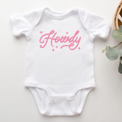 a Howdy Cowgirl Baby Rib Bodysuit in white