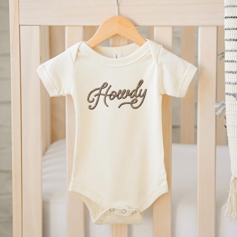 a Howdy Western Baby Onesie in natural