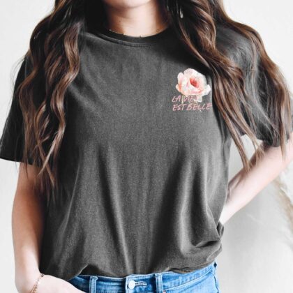 a woman wearing a La Vie Est Belle Tee in pepper