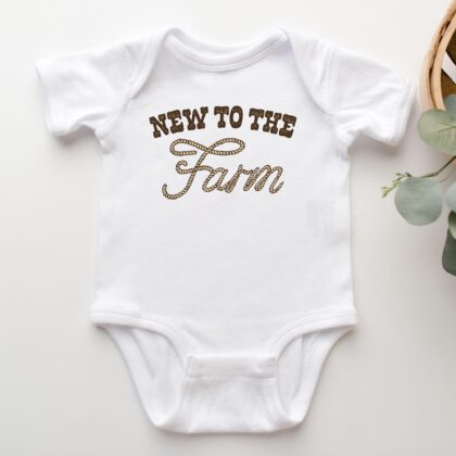 a New To The Farm Baby Rib Bodysuit in white