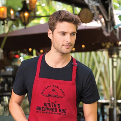 a man wearing a a Personalized Meat Smoker Apron - Charcoal Grill apron in red