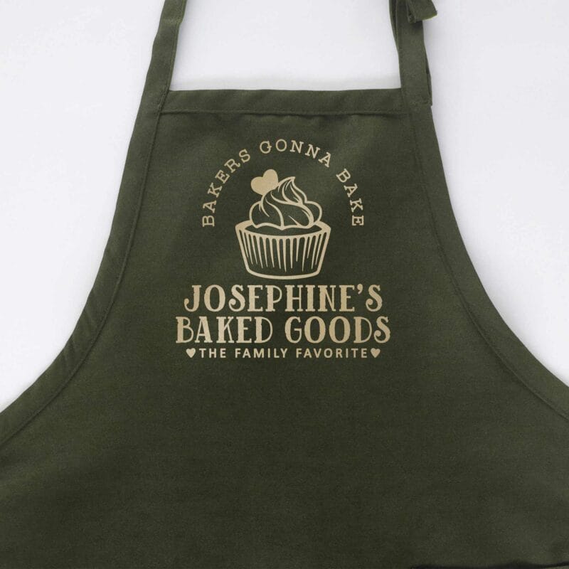 a cupcake baking apron in green
