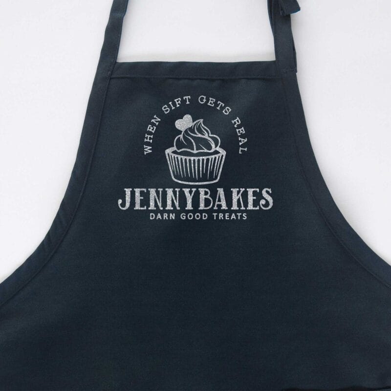 a cupcake baking apron in navy