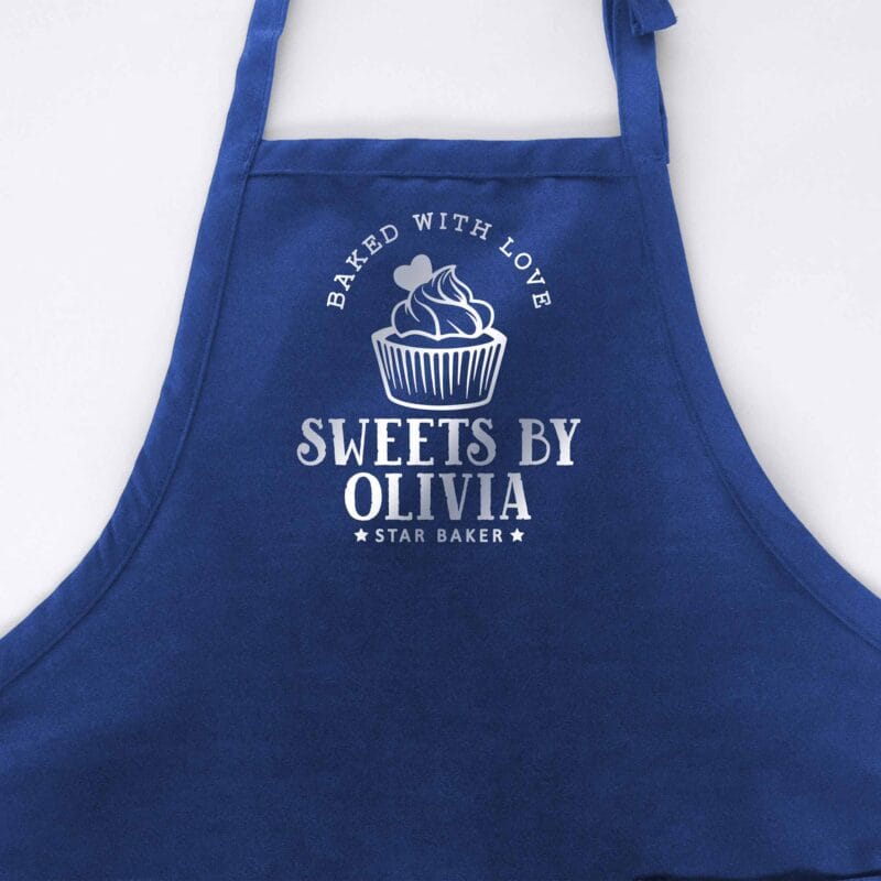 a cupcake baking apron in royal