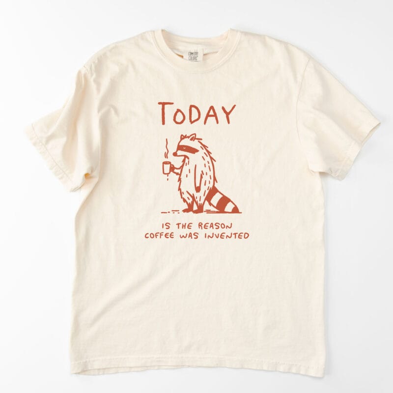 a coffee raccoon tee in Ivory