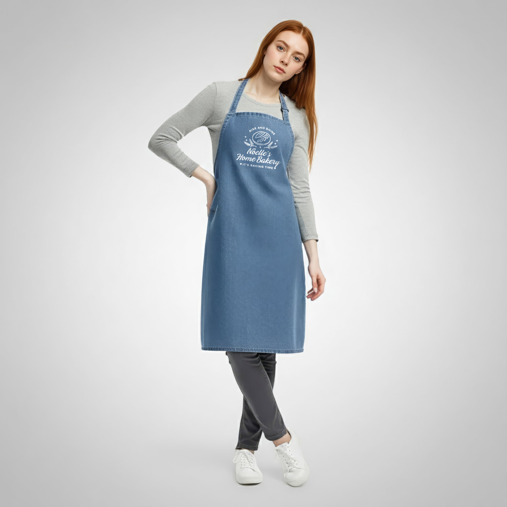 a young woman wearing a personalized eco denim sourdough apron in blue denim