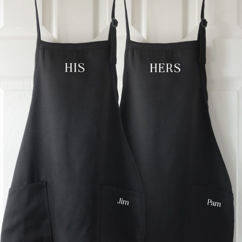 a personalized his hers apron set in black