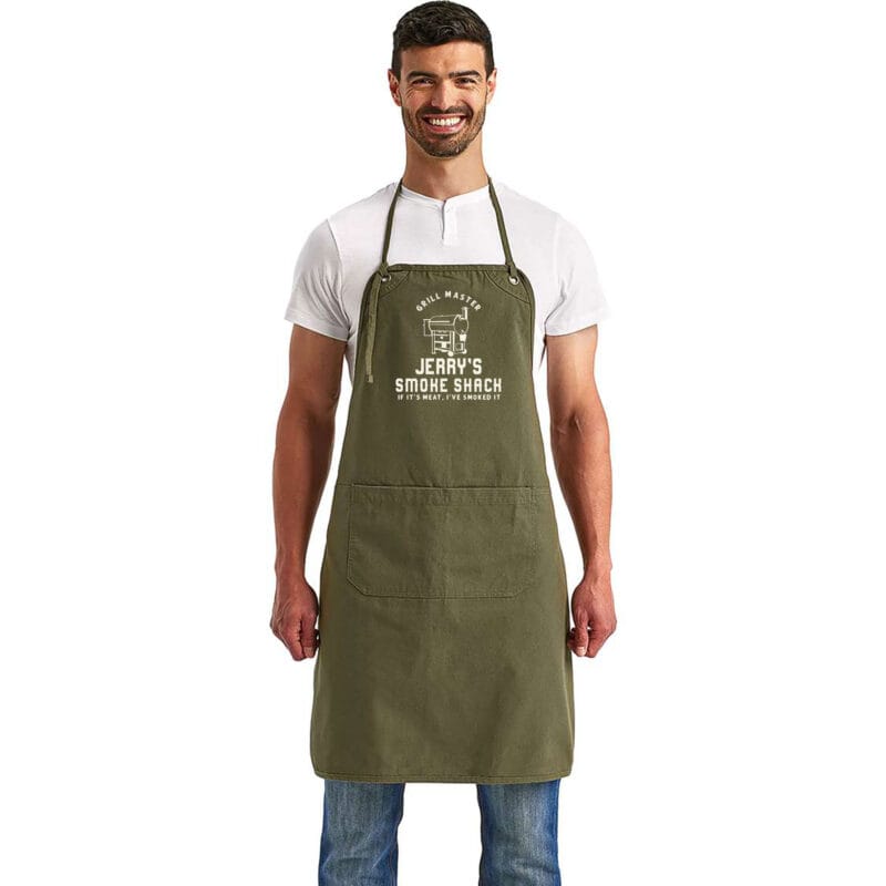 a man wearing a convertible personalized smoker apron in olive