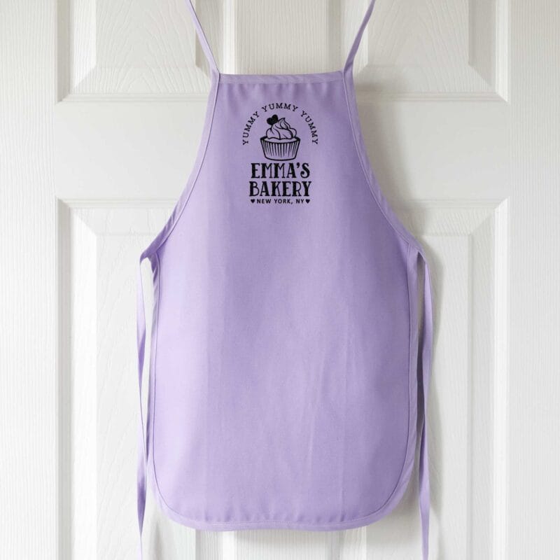 a personalized toddler cupcake baking apron in lavender