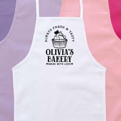 a personalized toddler cupcake baking apron in white