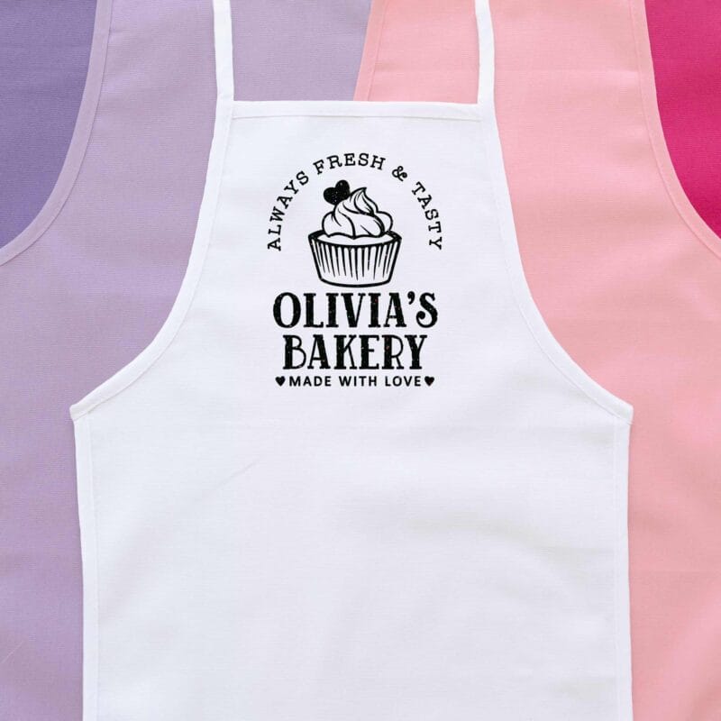 a personalized toddler cupcake baking apron in white