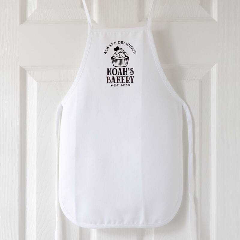 a personalized toddler cupcake baking apron in white