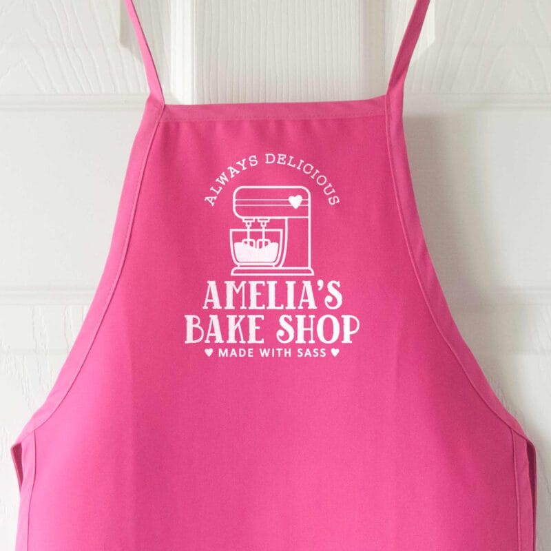 a personalized toddler mixer apron in hot pink