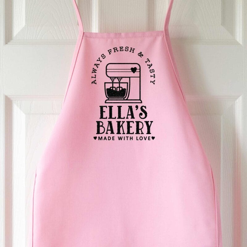 a kids personalized mixer apron in pink