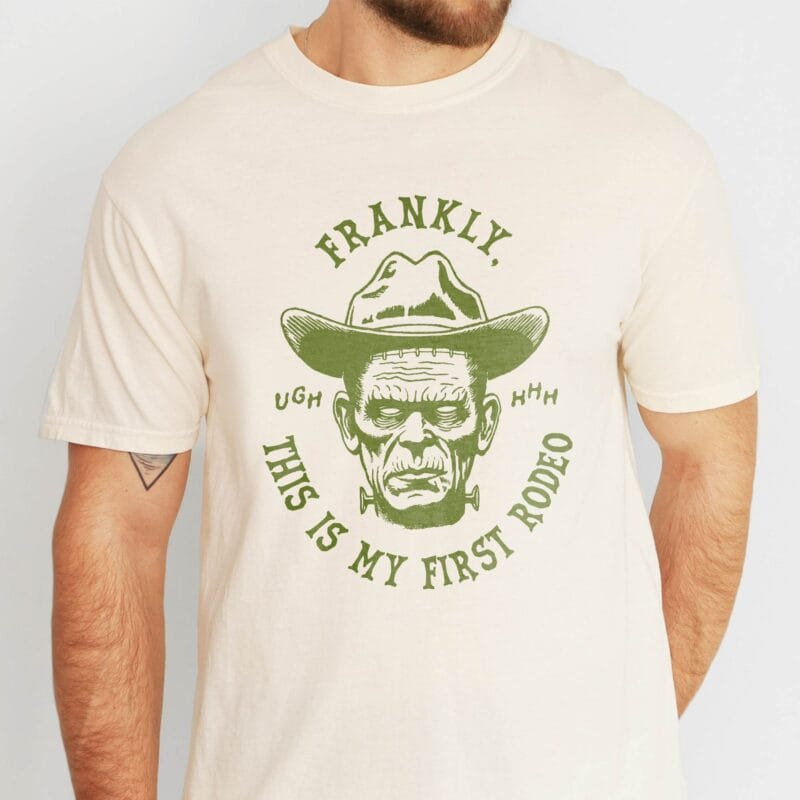a man wearing a fFirst Rodeo Halloween Monster Tee in ivory