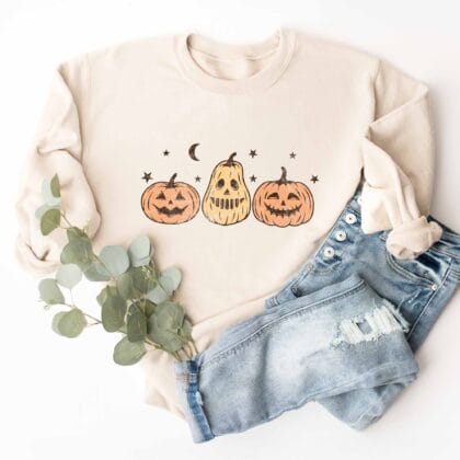 a Jack-O-Lanterns Halloween Sweatshirt in sand