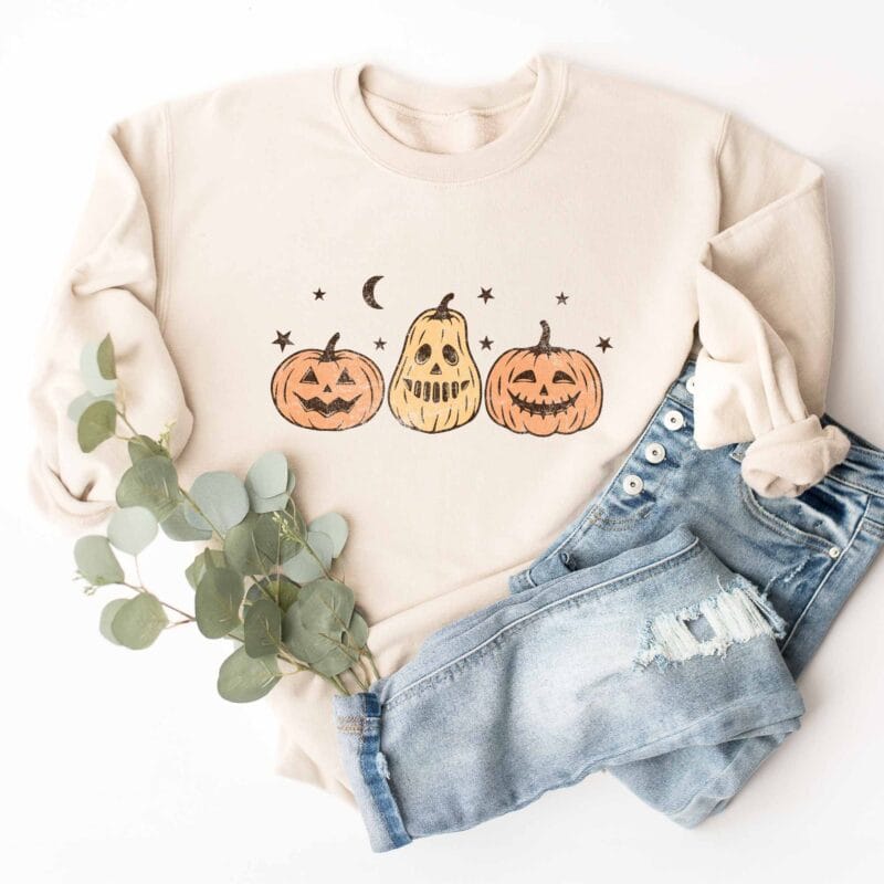 a Jack-O-Lanterns Halloween Sweatshirt in sand