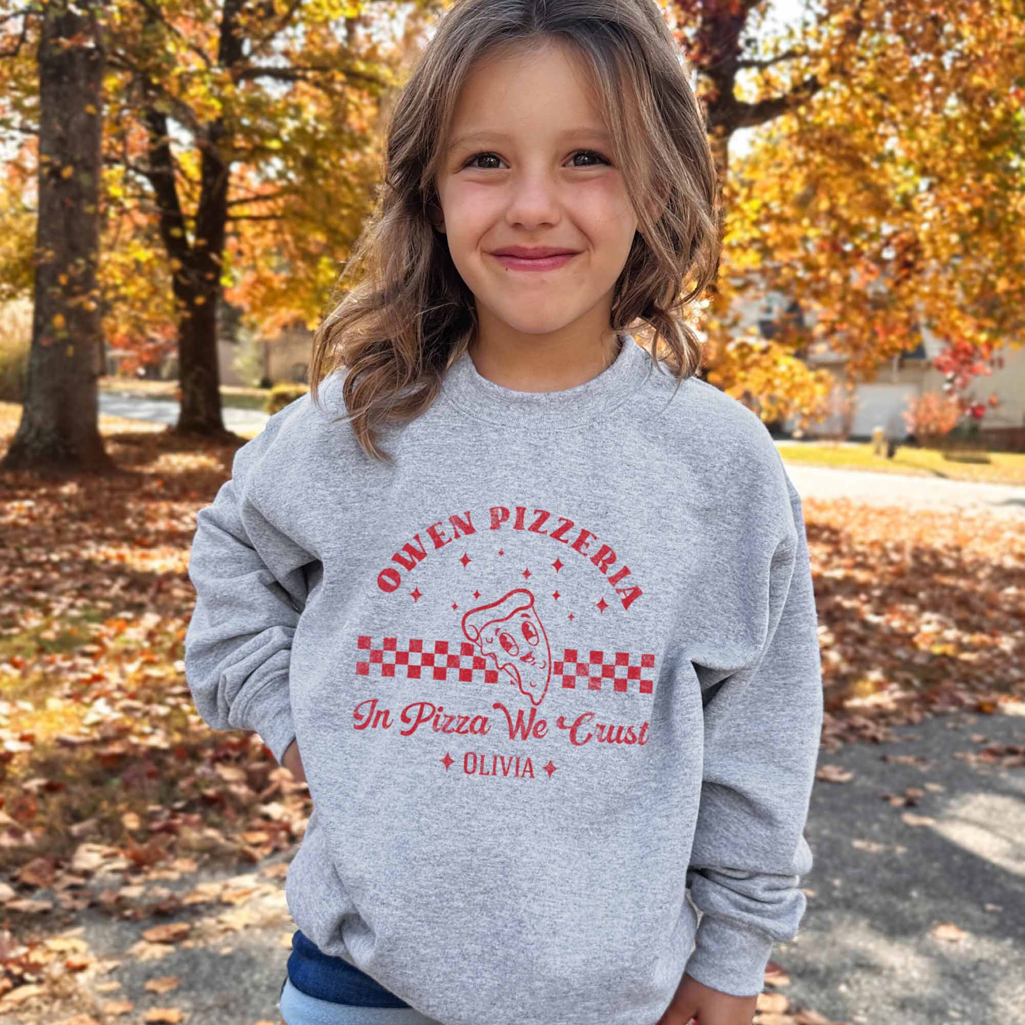 a little girl wearing a Kids Retro Pizza Sweatshirt in sport grey