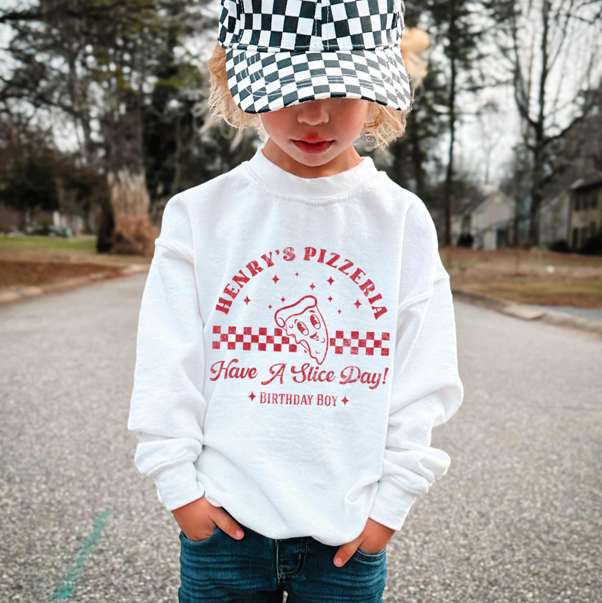a little boy wearing a Kids Retro Pizza Sweatshirt in white