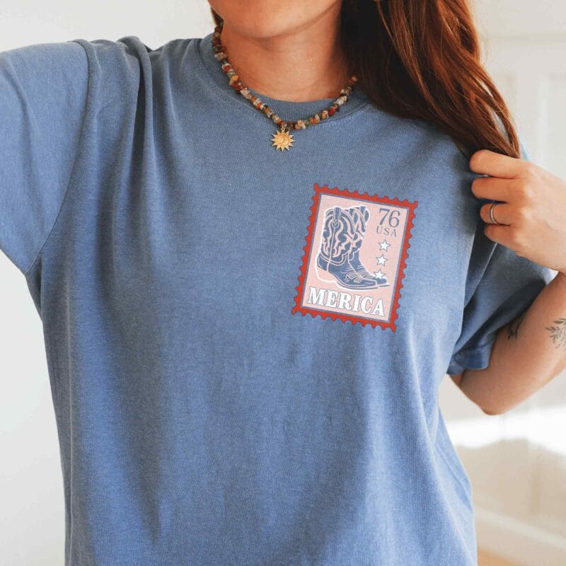a young woman wearing a Merica Cowgirl Tee in blue jean