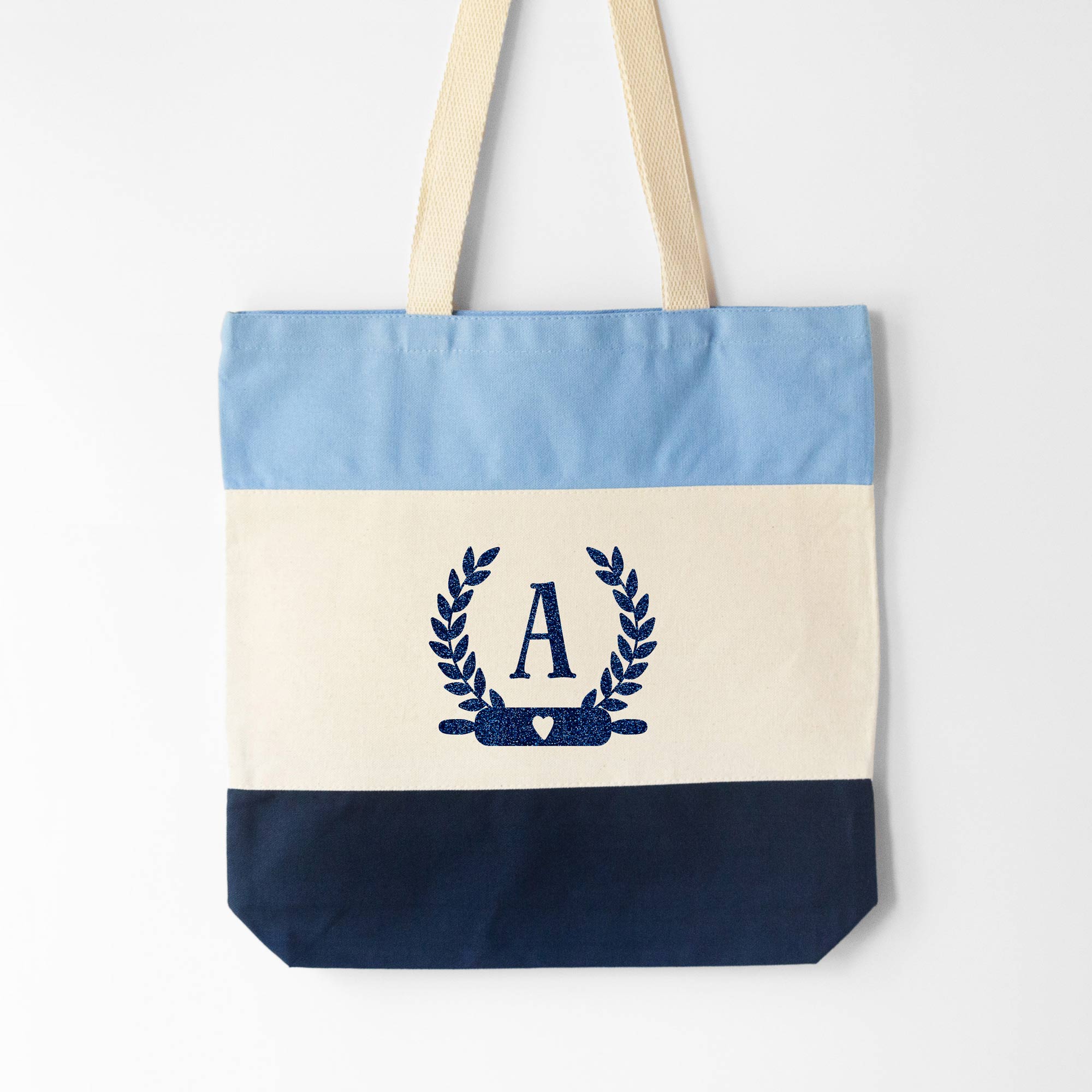 a Monogrammed Baker Tote in blue