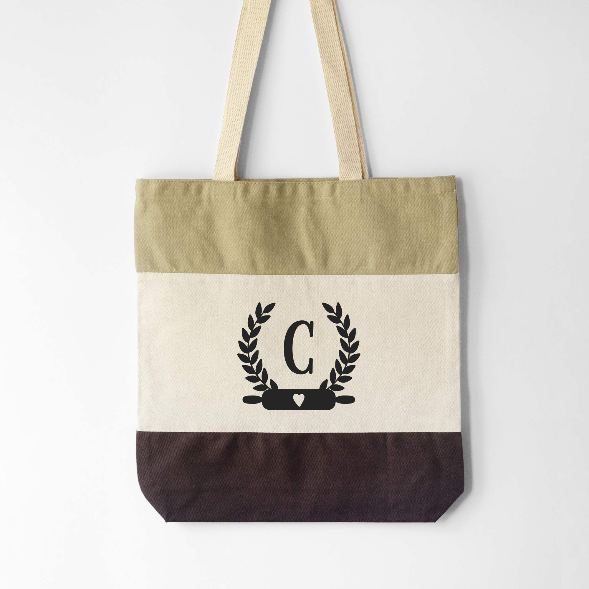 a Monogrammed Baker Tote in brown