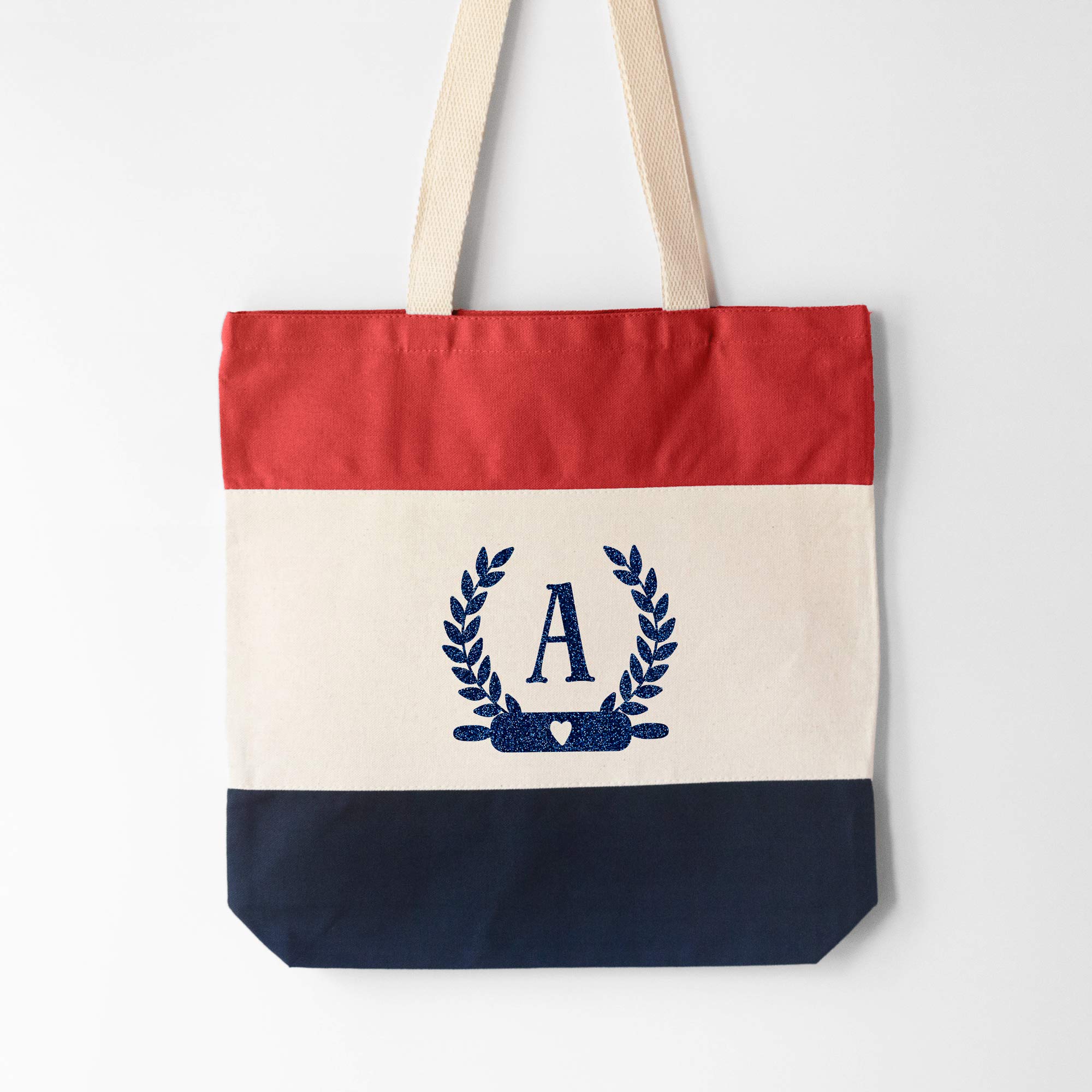 a Monogrammed Baker Tote in red