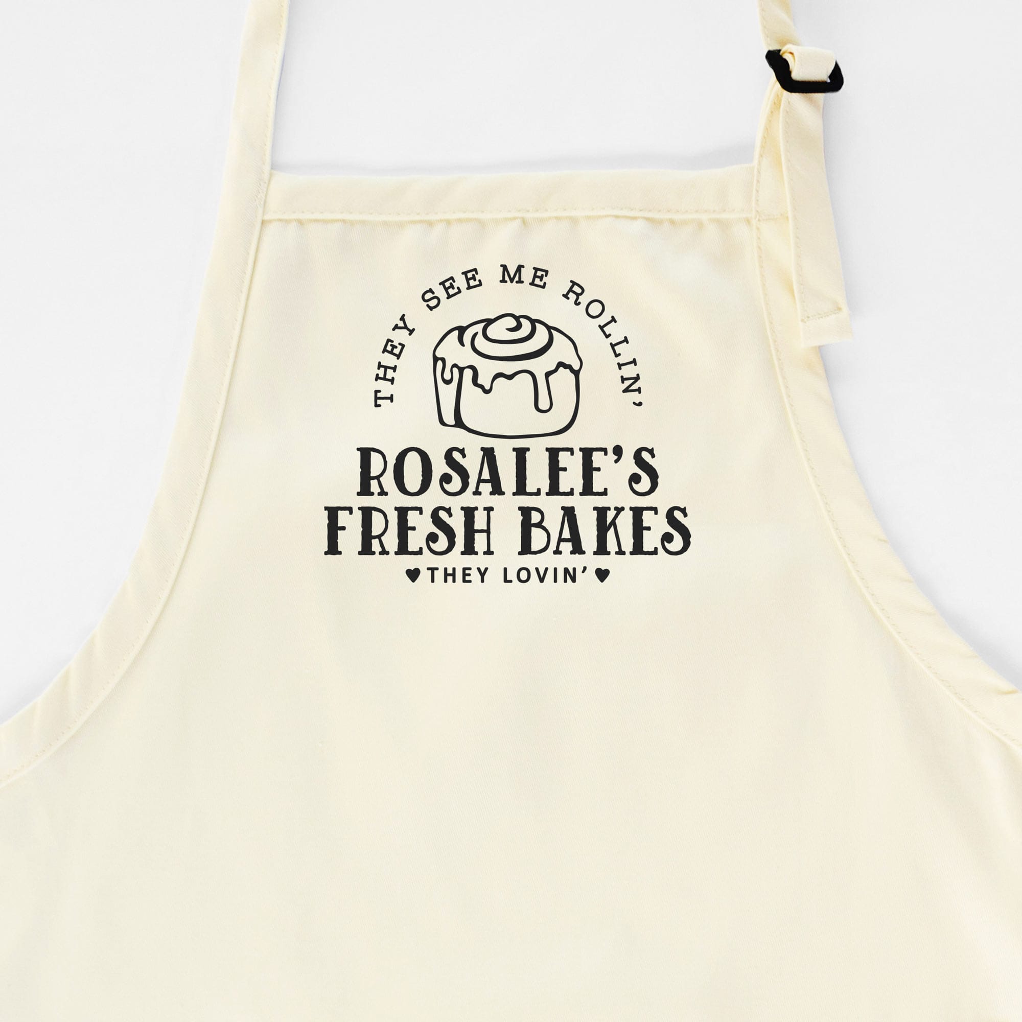a personalized cinnamon roll apron in natural