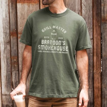 a man wearing a Personalized Meat Smoker Shirt in moss