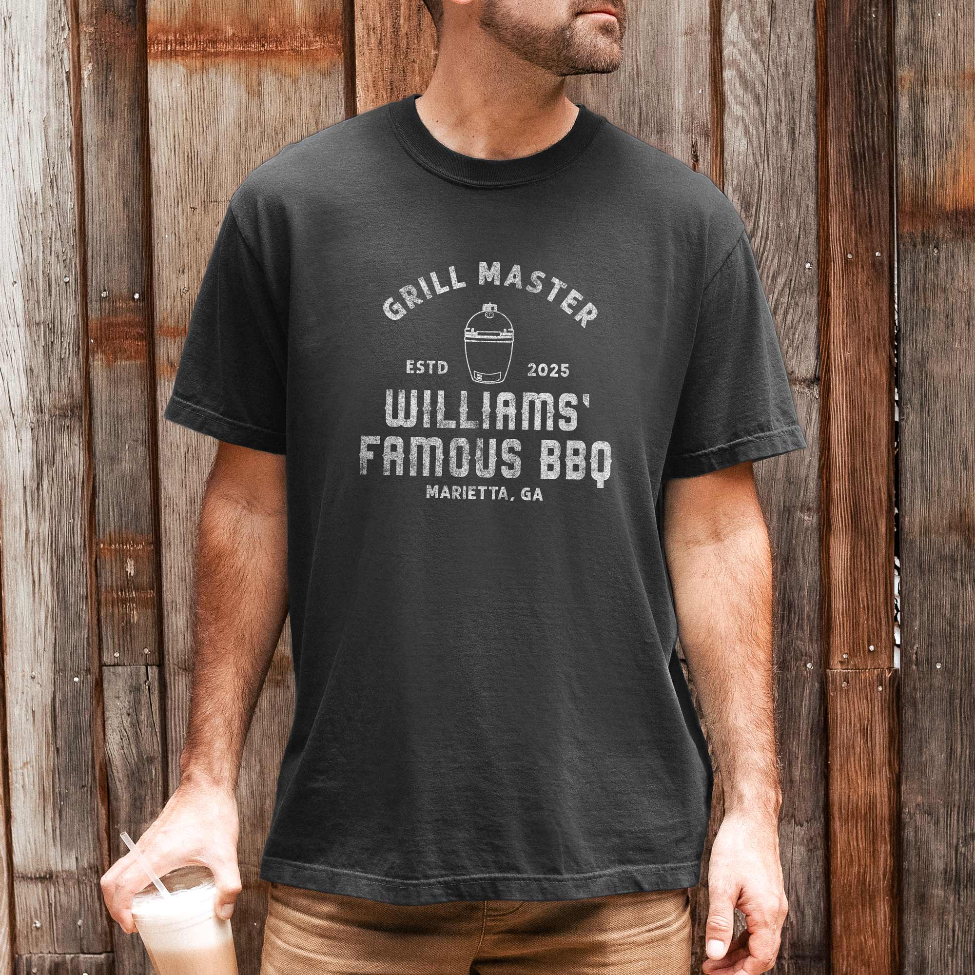 a man wearing a Personalized Meat Smoker Shirt in pepper