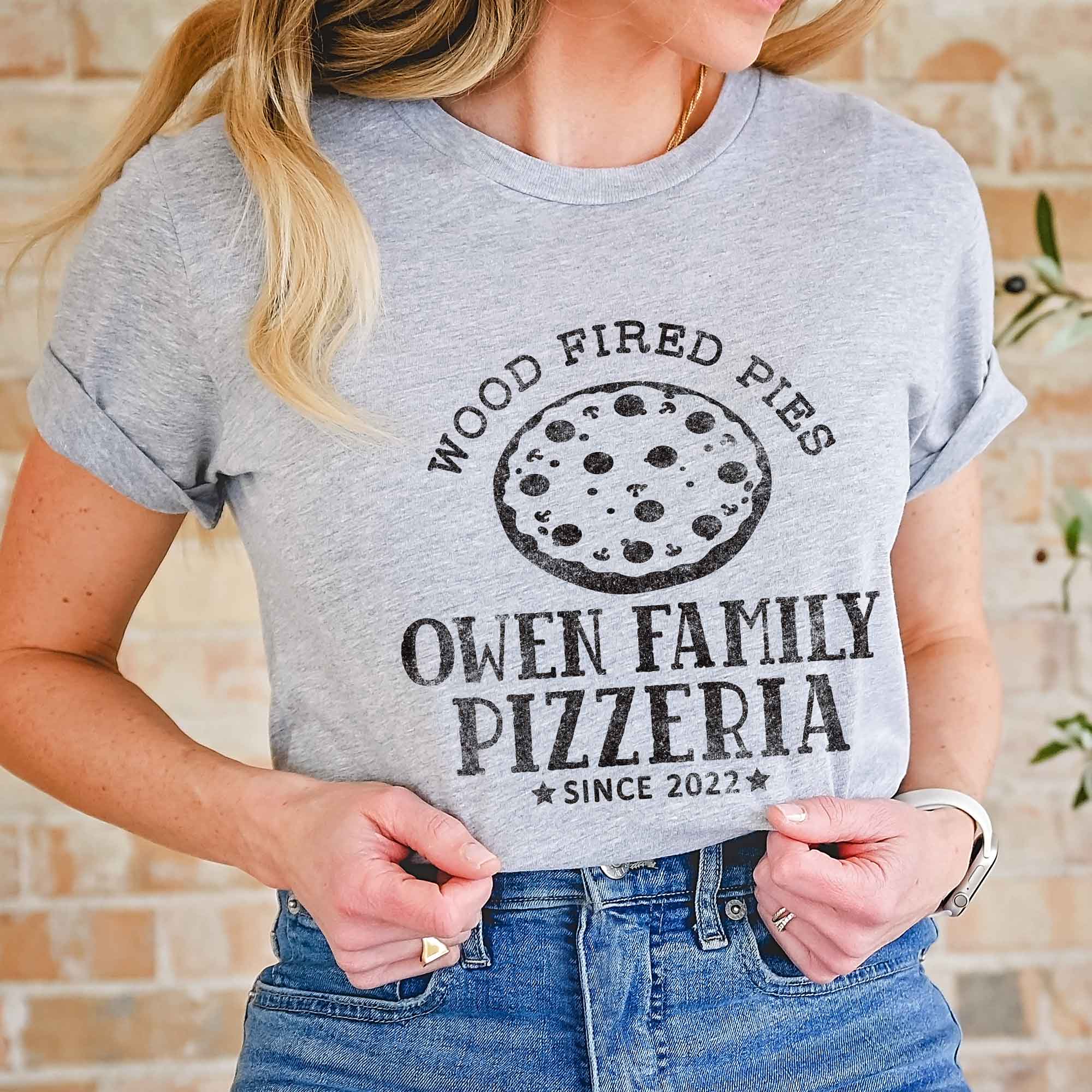a woman wearing a Personalized Pizza Shirt in athletic heather