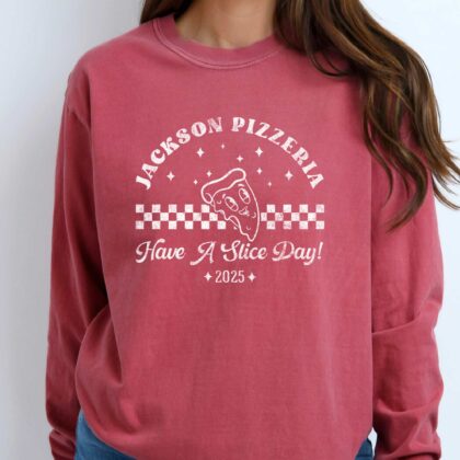 a woman wearing a long sleeve retro pizza t-shirt in red